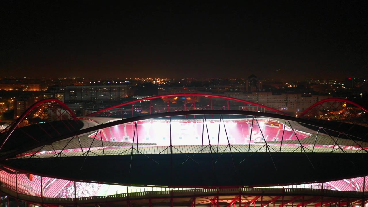 Aerial, orbit, drone shot, football arena, the Benfica stadium, at night time, in Lisbon, Portugal