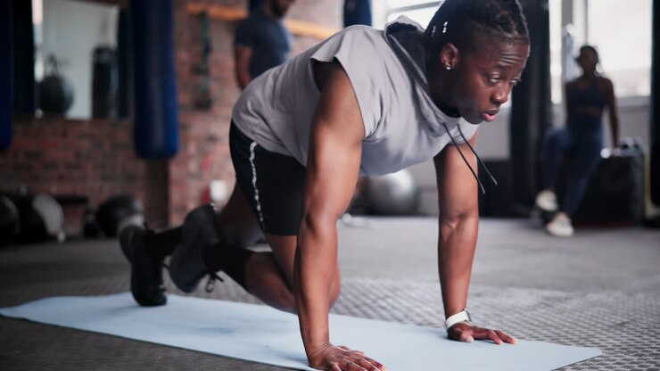 Man Doing Mountain Climbers Exercise in Gym