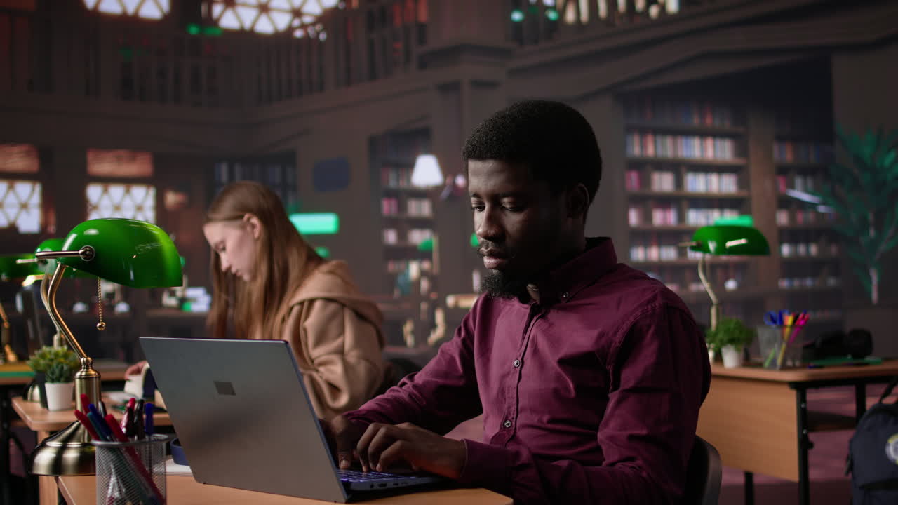 Vertical video black male student collecting academic information from the campus library