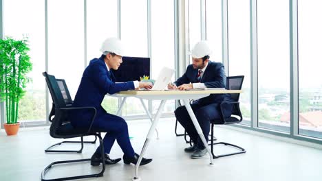 engineer and architect meeting at office table