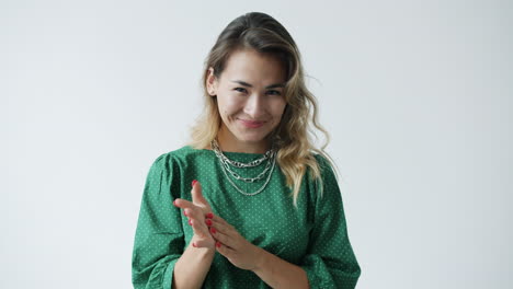 woman clapping and smiling
