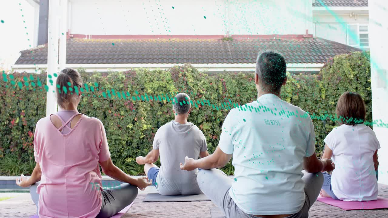 Guide cueing group moving from prayer to meditation on yoga mats teal overlay sweeping across group