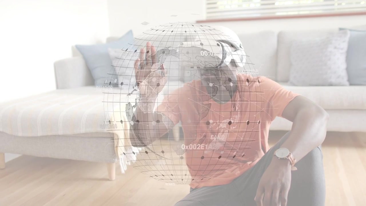 Man putting on VR in living room, technology holo globe responding to pinching, revealing data