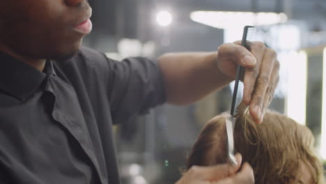 Afro-American-Hairdresser-Giving-Haircut-in-Barbershop