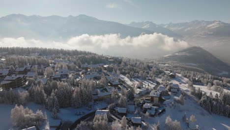 Aerial-shot-in-Switzerland-over-the-town-of-Crans-Montana,-Valais