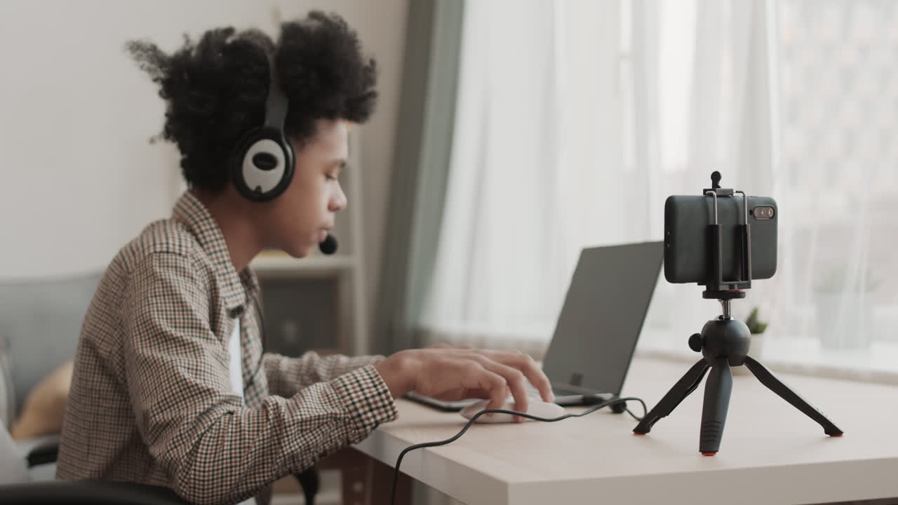 Smartphone Filming Young Computer Gamer