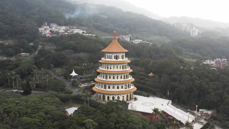 Dolly-out-with-upward-tilting-view-of-the-temple---Experiencing-the-Taiwanese-culture-of-the-spectacular-five-stories-pagaoda-tiered-tower-Tiantan-at-Wuji-Tianyuan-Temple-at-Tamsui-District-Taiwan