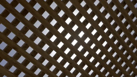 bright sun shining through the wooden net shed