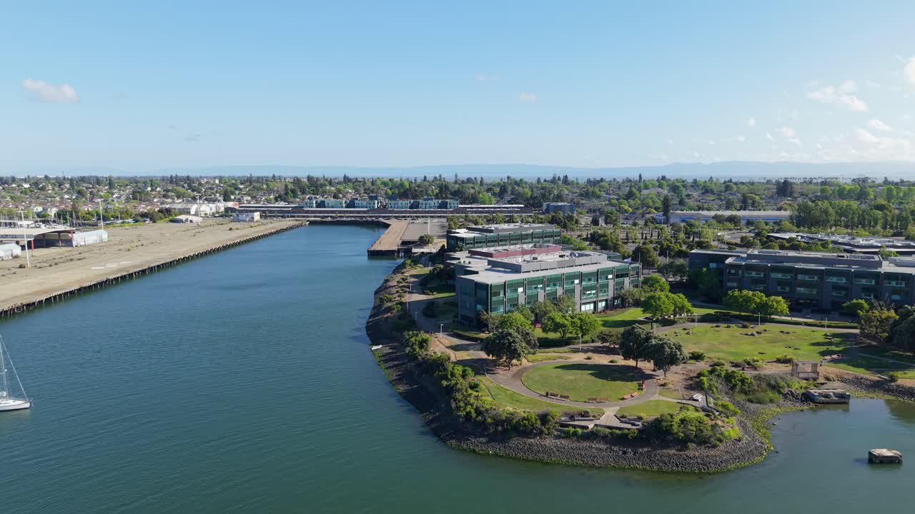 A panning drone view highlights Mariner Village’s scenic canals, reflecting sunlight across calm waters and capturing the community’s laid-back coastal character