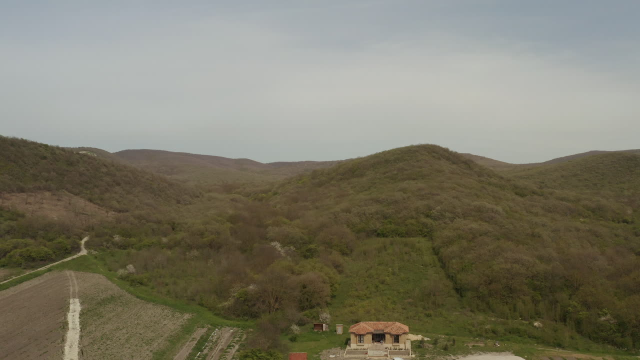Aerial View of Countryside Landscape with Hills and Forests
