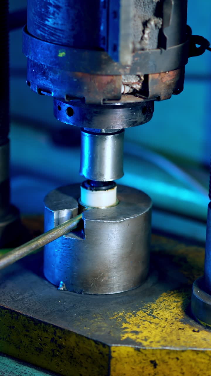 Machine tool in metal factory. Industrial machine in the factory at metalworks. Vertical video