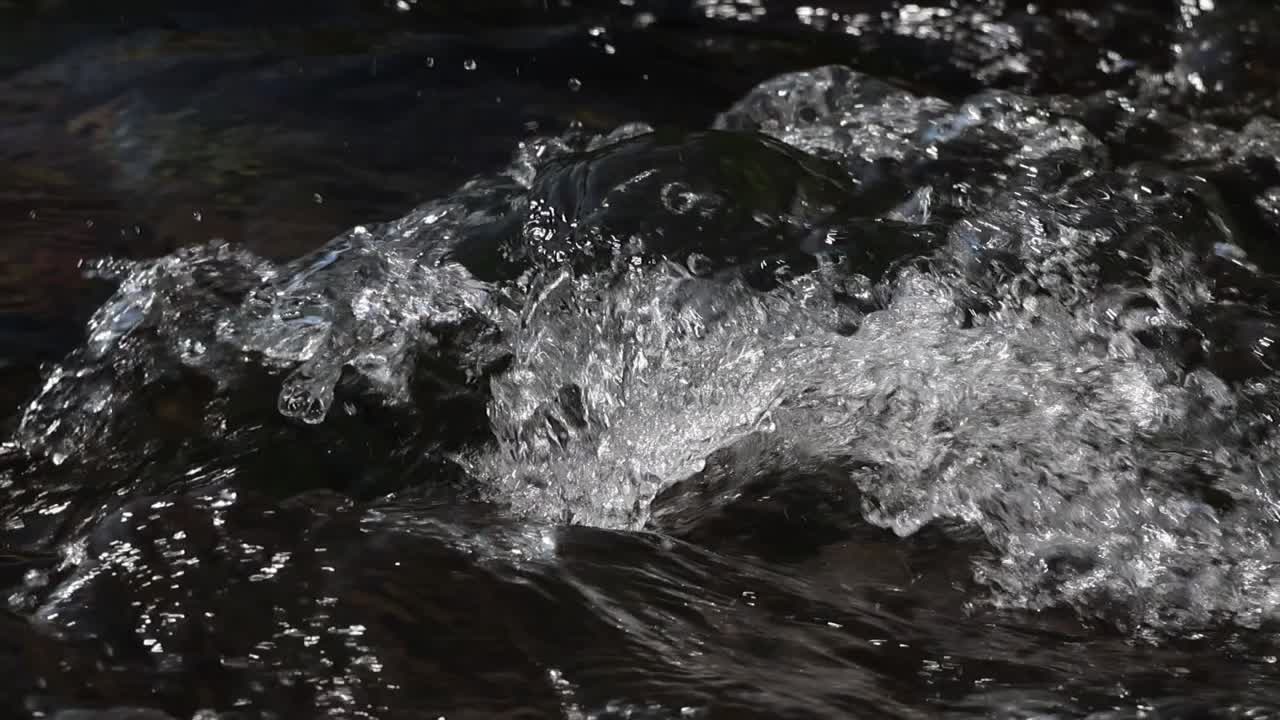 Fast-flowing water accelerating the river – nature footage scene