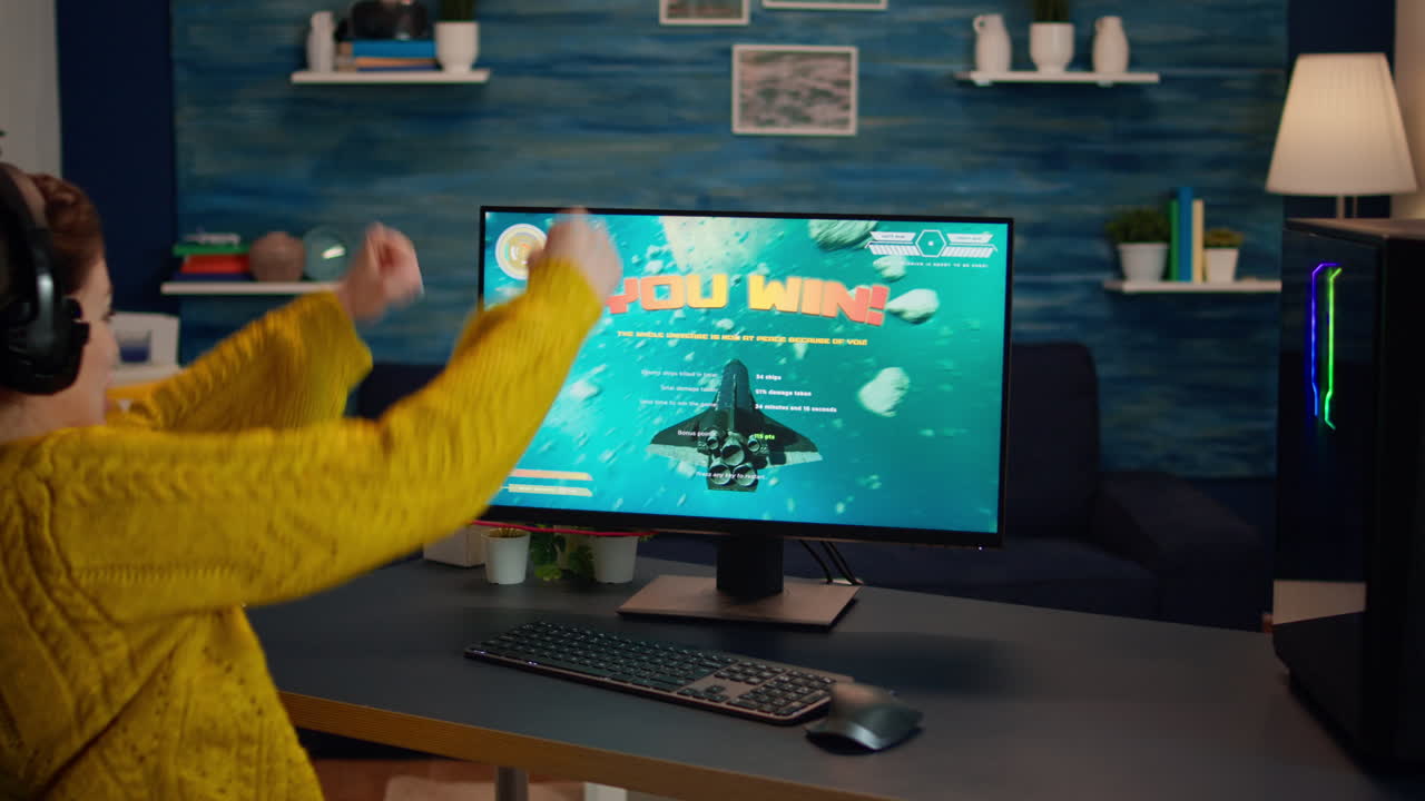 Happy professional cyber gamer winning video game