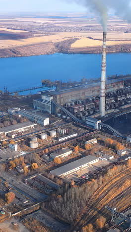 industrial factory pollutes sky. a large power plant works on the coast