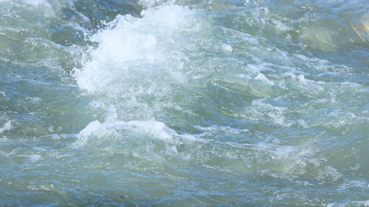 Vibrant, swirling water captured in Glenorchy Stream, showcasing natural movement and energy in a serene outdoor setting