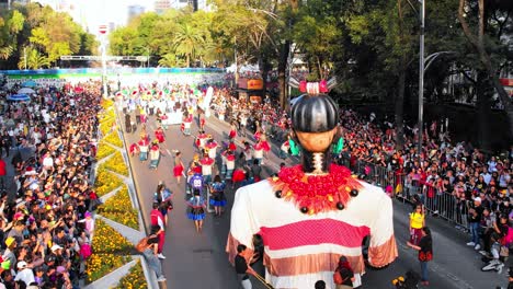 day of the dead parade and celebration on the streets of mexico city