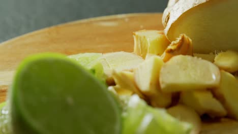 sliced ginger and lemon on a chopping board 4k