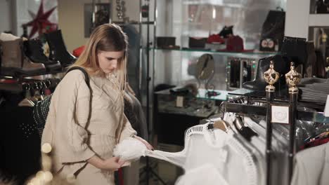 woman shopping for clothes in a fashion boutique