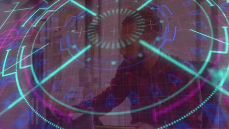 Neon-scope-scanner-and-hexagonal-shapes-over-grid-network-against-man-taking-notes-at-office