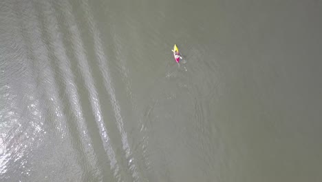 a single kayak driver is paddeling on sydney's waters