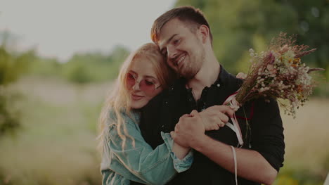 engaged attractive couple hug against camp 2