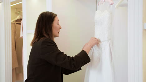 asian woman in wedding dress shop