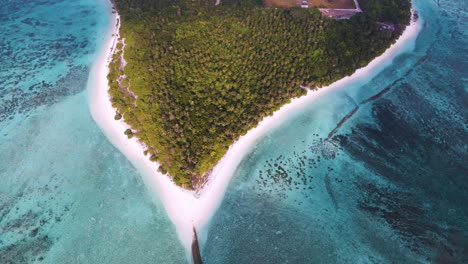 Top-view-of-the-Maldives-island,-where-the-city-is-located,-surrounded-by-the-incredible-color-of-the-water