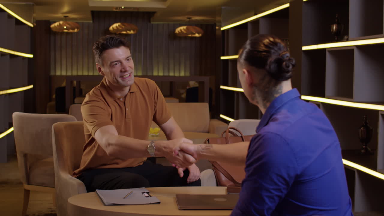 Two Businessmen Shaking Hands after Work