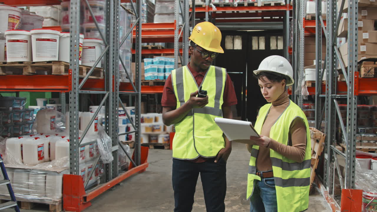 Warehouse Workers Having Conversation at Work