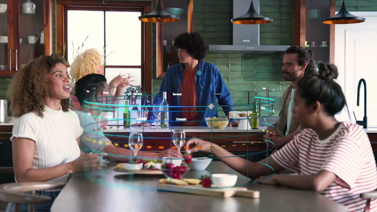 Left woman speaking and gesturing activating tech UI sweeping island as friends handling strawberry