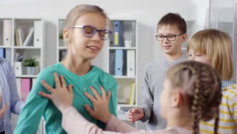 12-year-old girl playing trust game with friends and counselor