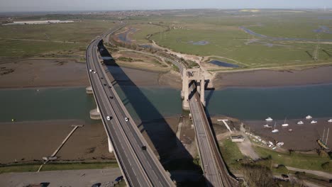 wide aerial drone view over the kingsferry bridge and sheppney crossin in kent england