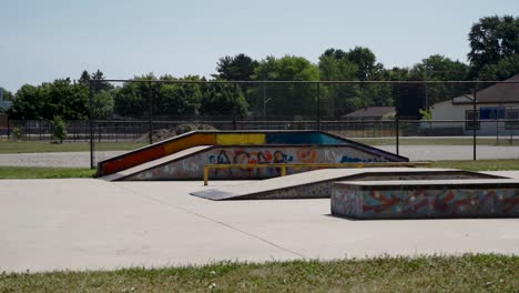 skateboard ramps and rails in a park in london, ontario