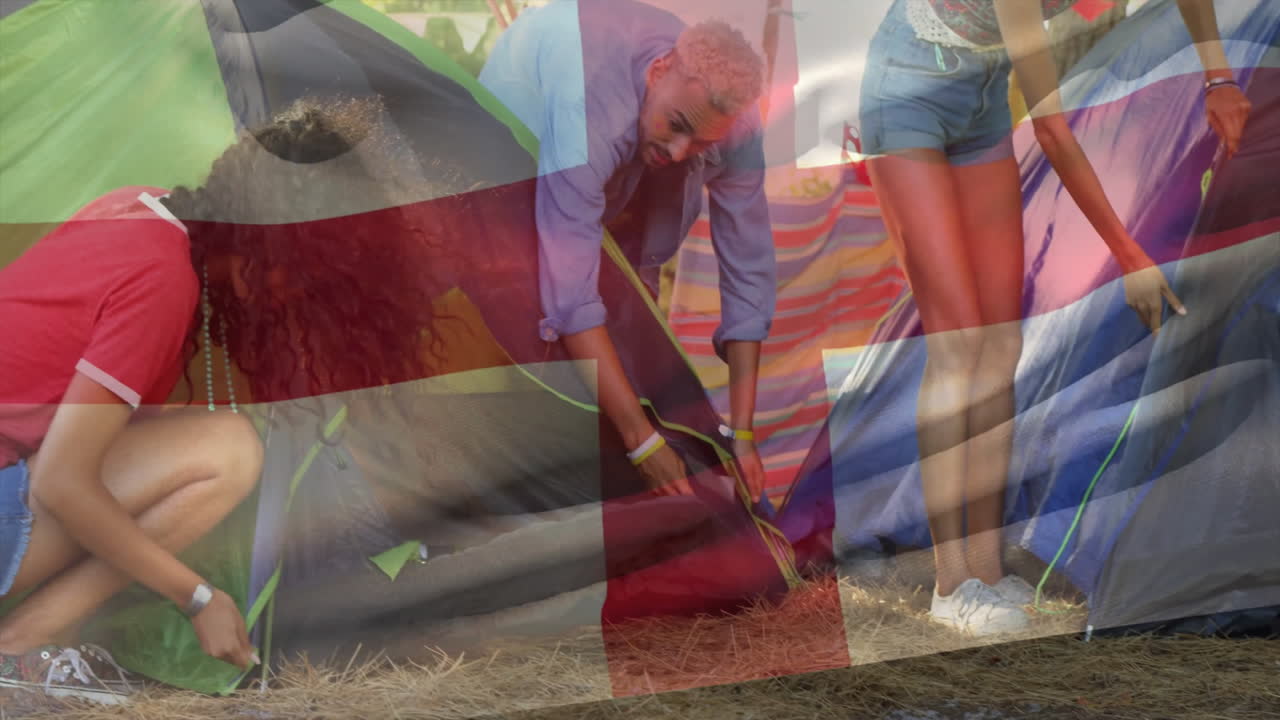 Setting up tents at campsite, people arranging gear with animation flag overlay