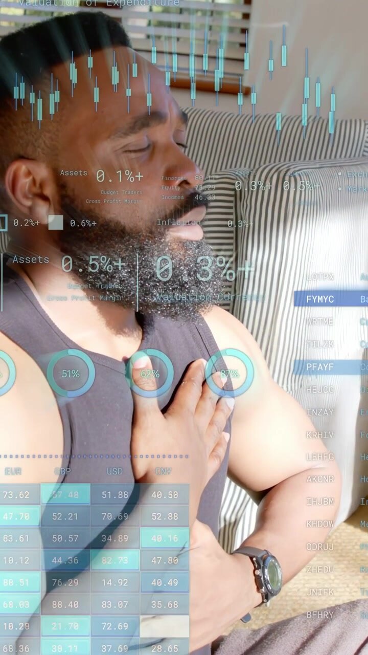 Vertical video: Man placing hand on chest, calming breath while finance charts overlaying chest