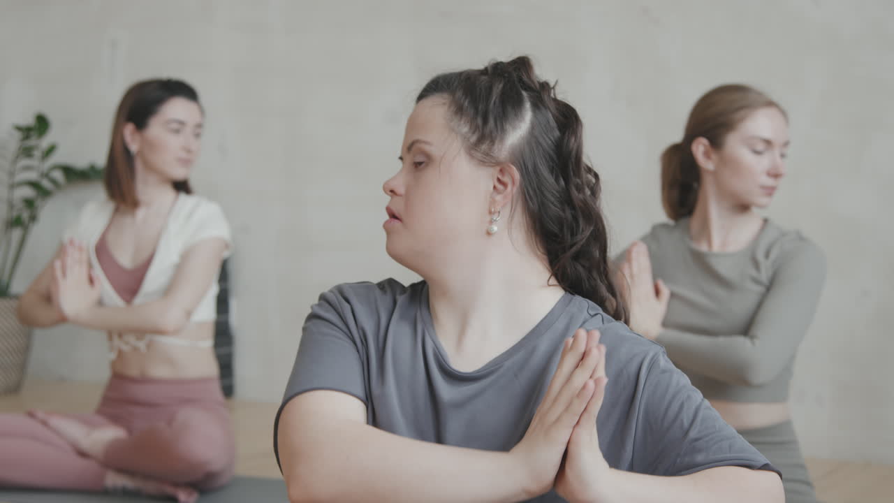 Young Woman With Down Syndrome Practicing Yoga Exercises