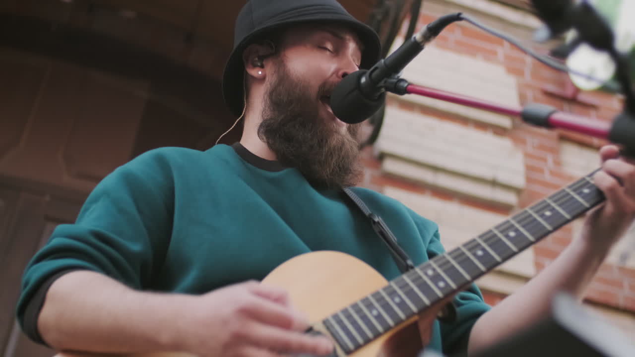Man Performing Song Outside