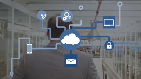 Animation-of-connections-with-icons-and-cloud-over-businessman