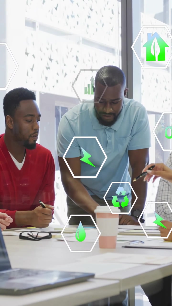Vertical video: lead leaning over table, pointing and causing green hex icons informing eco design