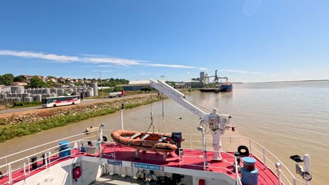 a boat approaches the pier in blaye, france