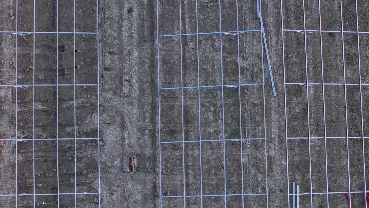 Ongoing development of a large-scale solar power installation replacing traditional farming fields, showcasing infrastructure