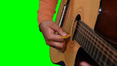 mid section of female musician playing guitar