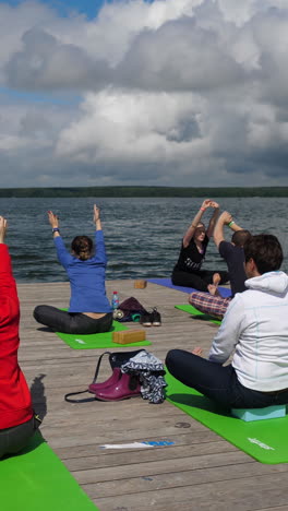 yoga practice outdoors near a lake