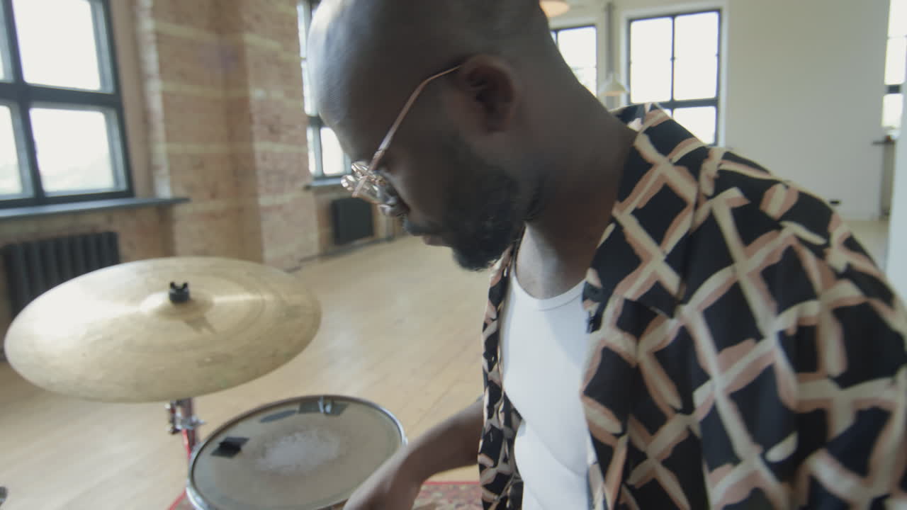 Black Musician Playing Drumset