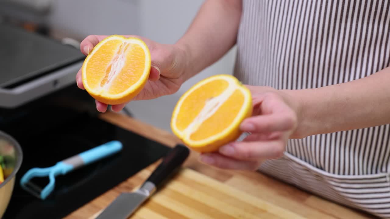 Preparing oranges in the kitchen