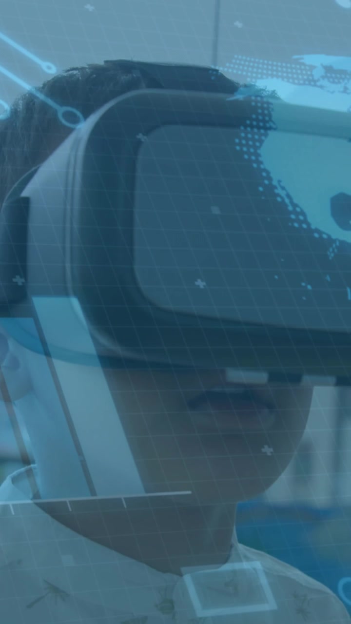 Animation of globe spinning and processor elements over schoolboy wearing vr headset