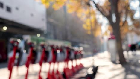 blurred view of scooters on a city street