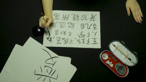 person practicing calligraphy