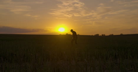 Drinked-Farmer-Walking-On-Agricultral-Field