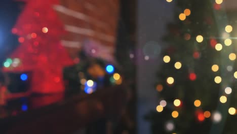 Animation-of-christmas-tree-with-glowing-lights-in-the-background